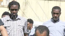 The accused, Kemani Gould, left, and Ashano Benjamin arrive at the Serious Offences Court on Monday, Nov. 13, 2023.