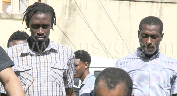 The accused, Kemani Gould, left, and Ashano Benjamin arrive at the Serious Offences Court on Monday, Nov. 13, 2023.