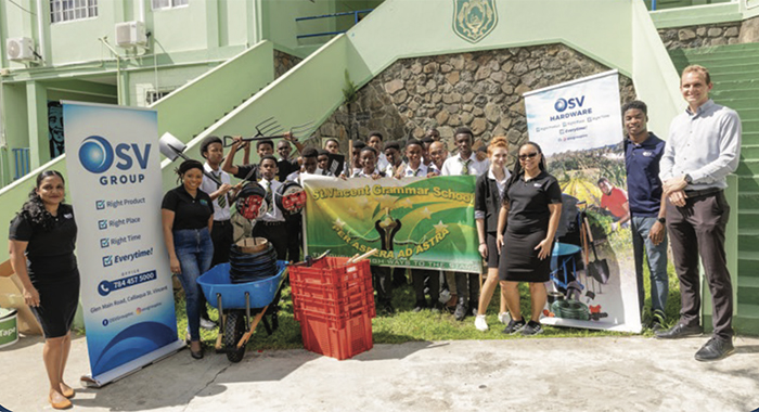 Representatives from OSV and ZHTF pose with students of the St. Vincent Grammar School with some of the items that were donated.