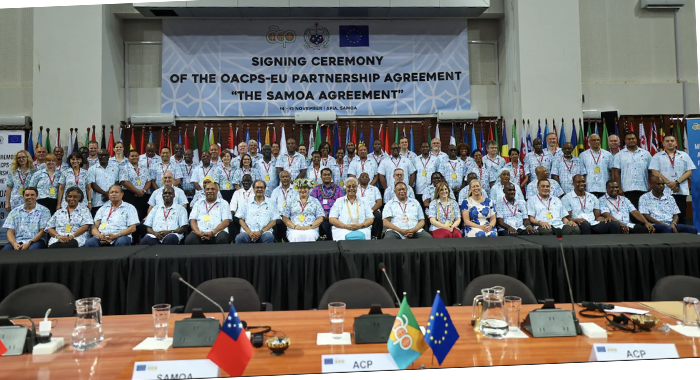 Delegates pose for a photograph after the singing of the Samoa Agreement in Samoa last week. 
