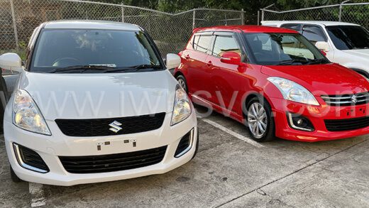 The two Suzuki Swift cars that Digicel is giving away during its Christmas promotion.