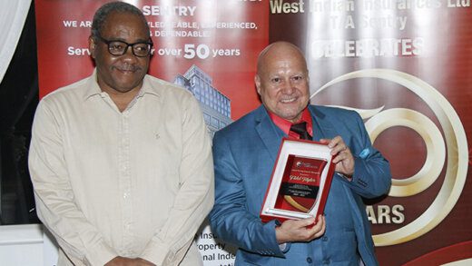 Chair of the Board of Directors of Sentry, Ralph Baynes, left, and the company's general manager, Fidel Taylor at the 50th anniversary dinner in Ratho Mill earlier this month.