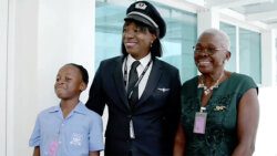 Rochelle Roach-Lanza, centre, the first Vincentian to pilot an American Airlines flight to Argyle International Airport, poses with her mother, Marilyn Roach, and a student of Argyle Primary School at the airport on Saturday, Dec. 9, 2023. 