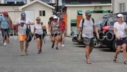 Cruise passengers walk back to their ship in Kingstown on Wednesday, Jan. 31, 2024.