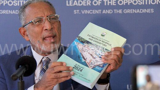 Opposition Leader Godwin Friday holds up a copy of the 2024 Estimates at a press conference in Kingstown on Wednesday, Jan. 10, 2024. He said the 2024 Budget was "a budget full of mistakes".