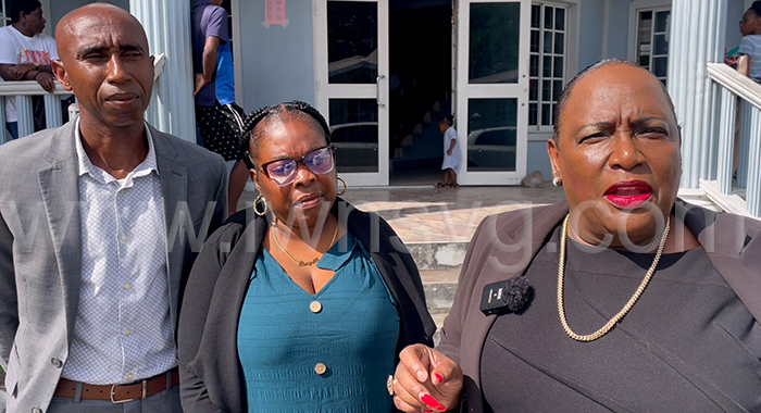 From left: The defendants, Carly John, Sherry Ann Caine and their lawyer, Kay Bacchus-Baptiste.