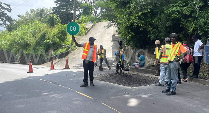 A work crew repairs a section of the Mandela Highway in Gibson Corner on Feb. 2, 2024.