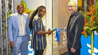 The ribbon cutting to the newly refurbished Flow office in Arnos Vale. From left: Wayne Hull, country manager Flow St. Vincent; Leroy Isaacs, Flow technician;  Waldo Hooker,  vice president, South Caribbean, C&W Communications. 