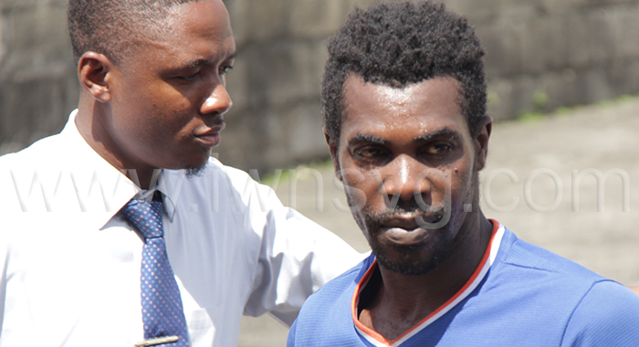 Police escort burglary accused, Kent Blake to the Kingstown Magistrate's Court on Wednesday, March 20, 2024.