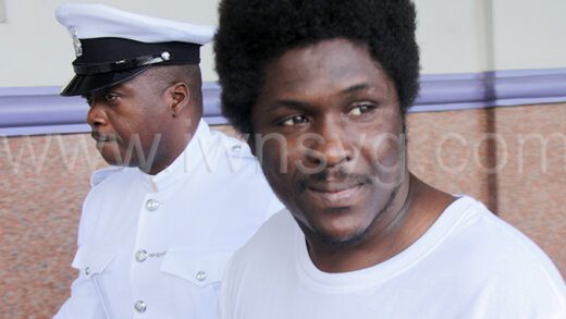 The defendant, Cornelius Kennedy looks in the direction of the Central Market, the scene of one of his Dec. 2, 2021 attacks, as he is returned to prison on March 25, 2024.