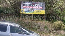 The NDP's billboard at Gibson Corner.