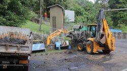 Heavy equipment clean a gutter in Sion Hill on Sunday, June 30, 204 ahead of Monday's anticipated impact of Hurricane Beryl, a category 4 cyclone.