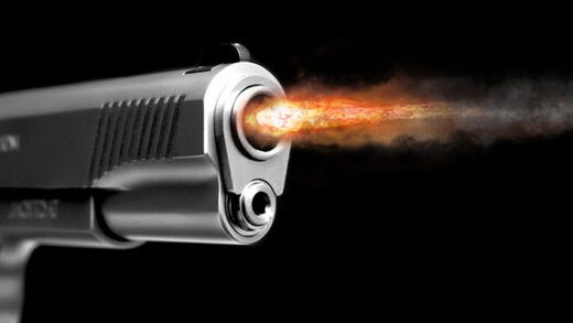 A fire from the gun after the shot. Gunshot