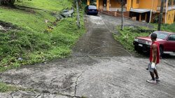 A man looks at a power lines blown down in Rillan Hill during the passage of Hurricane Beryl on Monday, July 1, 2024.