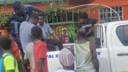 One of the suspects in the attempted robbery sits in the pan of a police vehicle in South Rivers on Tuesday, July 17, 2024.