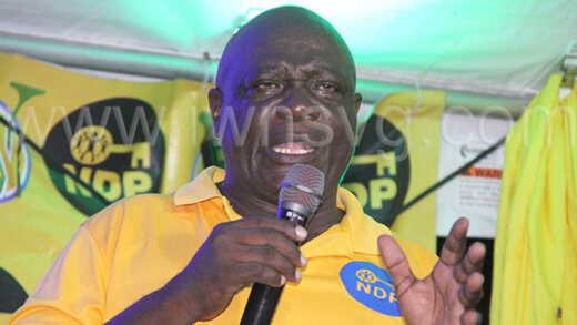 New Democratic Party candidate Andrew John speaking at the party's village meeting in Enhams on Wednesday, Aug. 28, 2024. 