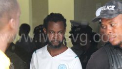 Former national footballer Damal Francis aka Ratty is escorted from the Barrouallie Magistrate's Court to prison on Wednesday, Aug. 28, 2024.