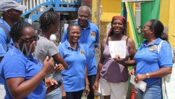 Representatives of the SVG Teachers Co-Operative Credit Union present a cheque to a member and resident of Union Island in Union Island on Saturday, Aug. 24, 2024. 