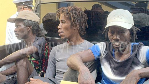 The St. Lucians arrive at the Serious Offences Court in a police pick-up in Kingstown on Sept. 18, 2024.
