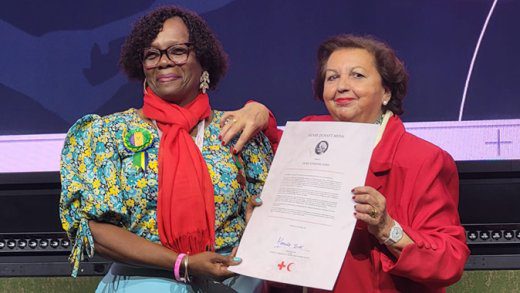 Dora James, left, receiving the award from Mercedes Babe in Switzerland on Sunday, Oct. 27, 2024.