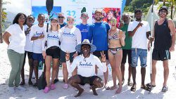 Annette Mark, chief executive officer of the St. Vincent and the Grenadines Tourism Authority, left, celebrates with local and UK athletes after completing their 10k kayak back to Sandals Saint Vincent and the Grenadines.