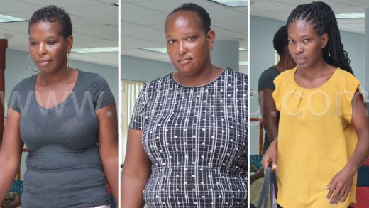 The defendants. From left: Roxy Baptiste, Lukiesha Baptiste and Azania Caine outside the Georgetown Magistrate's Court on Oct. 7, 2024.