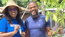 Kenna Questelles, who has launched an independent candidacy to become MP for West St. George, interacts with a farmer in the constituency on Oct. 5, 2024. 