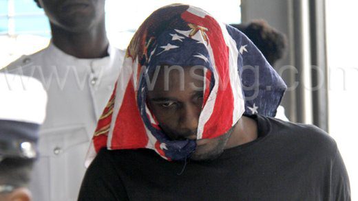 Uranus Cabral used a bandana to cover his head as he is escorted to prison on Friday, Jan. 17, 2024.
