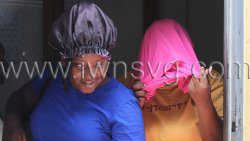 The defendant, Dianza Dublin hides her face as she leaves the Serious Offences Court on Monday, Feb. 17, 2025.