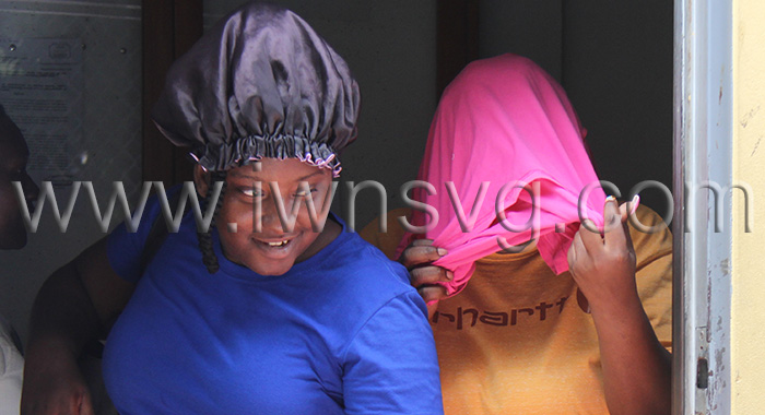 The defendant, Dianza Dublin hides her face as she leaves the Serious Offences Court on Monday, Feb. 17, 2025.