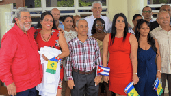 Prime Minister of St. Vincent and the Grenadines, Ralph Gonsalves, furthest, right, and President of Cuba, Miguel Díaz-Canel, in white at the rear, pose with Cuba health workers at a public hospital in Georgetown, St. Vincent in December 2020. (Photo: Facebook/ APISVG)