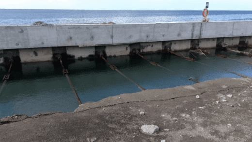 A photo showing seawater inside the quay wall at the port being built in Kingstown.
