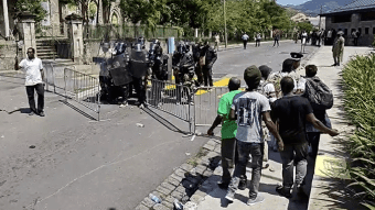 Dominica police fire tear gas and rubber bullets at protesters outside the Parliament building on Wednesday, March 19, 2025, as legislators debate electoral reform legislation (Image: Dominica News Online)