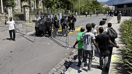 Dominica police fire tear gas and rubber bullets at protesters outside the Parliament building on Wednesday, March 19, 2025, as legislators debate electoral reform legislation (Image: Dominica News Online)