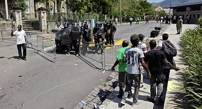 Dominica police fire tear gas and rubber bullets at protesters outside the Parliament building on Wednesday, March 19, 2025, as legislators debate electoral reform legislation (Image: Dominica News Online)