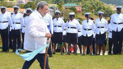 Prime Minister Ralph Gonsalves hold a staff that the visiting Garifuna presented to him on March 14, 2025, at Dorsetshire Hill, when they honoured him as a "Messenger of Chatoyer"
(Photo: Facebook//APISVG)