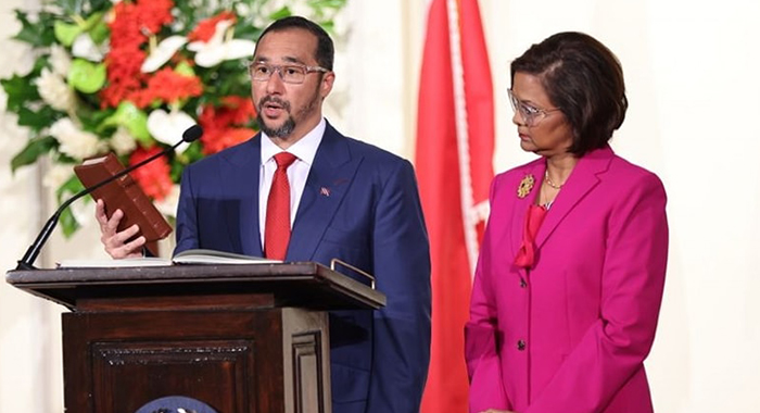 Stuart Young, left, takes the relevant oath as he is sworn in on Monday as prime minister of Trinidad and Tobago, as and President Christine Kangaloo looks on. (Photo: Facebook/OPMTT)