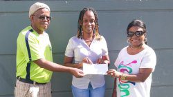 Members of the Vincy Unity Picnic Committee in Canada Suzette Weekes, right, and Jim Lewis, centre, handing over the cheque to Melissa Gellizeau of Union Island Environmental Alliance.