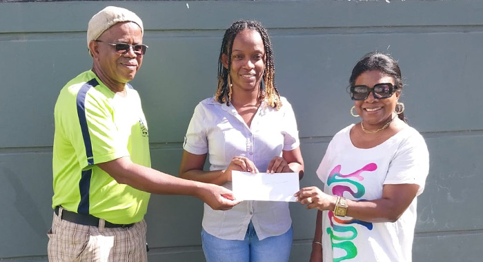 Members of the Vincy Unity Picnic Committee in Canada Suzette Weekes, right, and Jim Lewis, centre, handing over the cheque to Melissa Gellizeau of Union Island Environmental Alliance.
