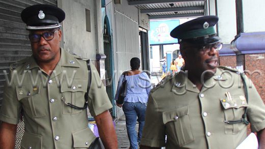 Acting Superintendent of Prisons, Dwayne Bailey, left, and Assistant Superintendent of Prisons Julian Clarke leave High Court No. 2, in Kingstown on Wednesday, April 16, 2024.
