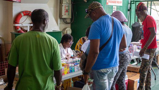 Residents of Union Island collect free prescriptions aboard after consultations with the medical team during the Rotary Village Doctor outreach.