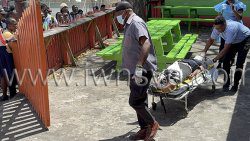 Ambulance workers take the injured man from the scene for transportation to hospital on Tuesday, April 1, 2025. 
