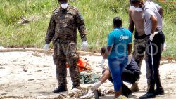Police at the scene in Canouan, where the boat washed up on Monday, May 26, 2025. (Photo: Canouan Islanders)