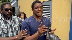 Murder Kesroy Ryan, right, is escorted from the Serious Offences Court in Kingstown by detective Station Sergeant Biorn Duncan on May 26, 2025.