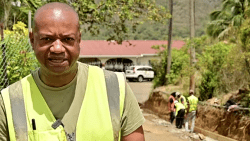 Attorney General Grenville Williams speaking to state media in April 2024 about public works project in South Leeward.