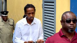The accused, Leon John, in police custody outside the Serious Offences Court on Monday, June 16, 2025.