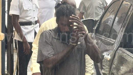 The accused, Alanzo Corridon arrives at the Serious Offences Court during a light drizzle on Thursday, July 3, 2025.