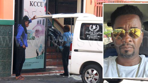 Funeral home workers remove the body of Shernard Gloster, 47, of Barrouallie, insert, from the KCCU headquarters on Granby Street, Kingstown, where an on-duty security guard from Guardsman SVG Ltd. shot him dead on Wednesday, July 9, 2025. 