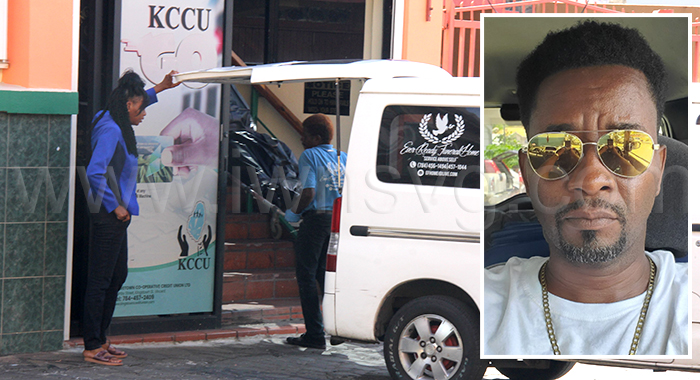 Funeral home workers remove the body of Shernard Gloster, 47, of Barrouallie, insert, from the KCCU headquarters on Granby Street, Kingstown, where an on-duty security guard from Guardsman SVG Ltd. shot him dead on Wednesday, July 9, 2025. 