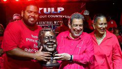 Prime Minister Ralph Gonsalves, centre, his wife, Eloise Gonsalves, right, and their son, Storm Gonsalves, in Colonarie on Aug. 9, 2025. 